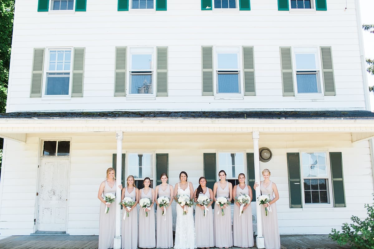 Arielle Peters Photography | Bride and bridesmaids on historic front porch on wedding day at St. Joe Farm in Granger, Indiana.