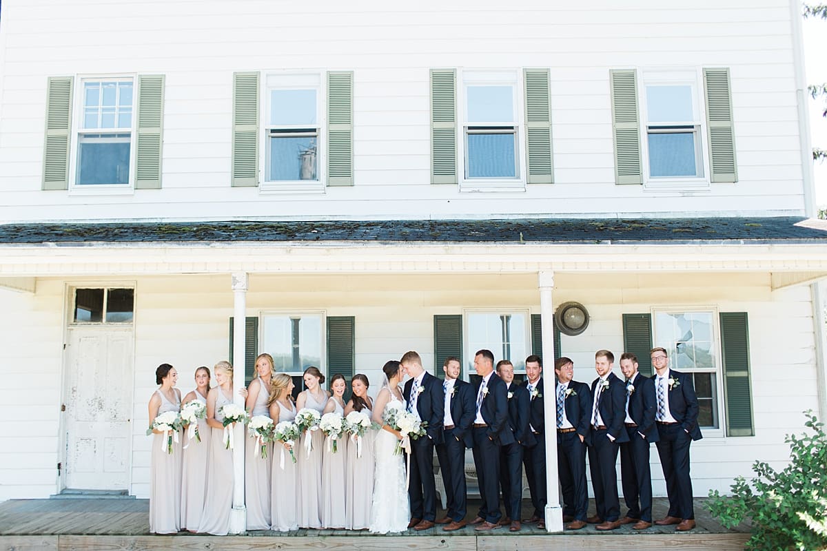 Arielle Peters Photography | Wedding party on historic front porch on wedding day at St. Joe Farm in Granger, Indiana.