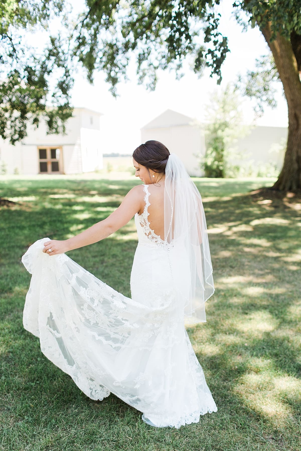 Arielle Peters Photography | Back of bride's dress at historic farm on wedding day at St. Joe Farm in Granger, Indiana.