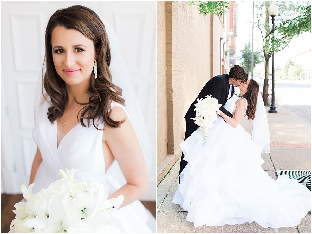 Arielle Peters Photography | Bride and groom kissing on city streets on wedding day at Loft 310 in Kalamazoo, Michigan.