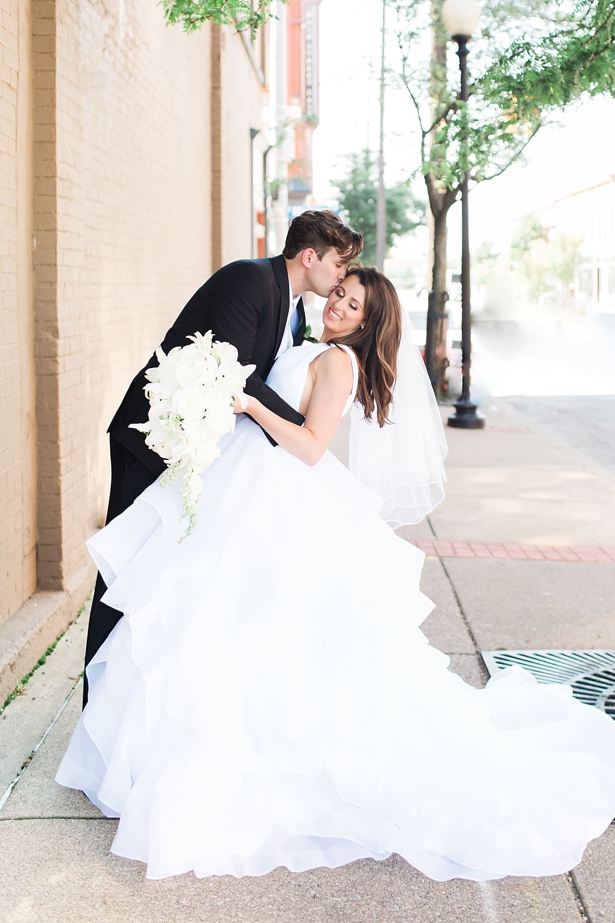 Arielle Peters Photography | Bride and groom dancing in city streets on wedding day at Loft 310 in Kalamazoo, Michigan.