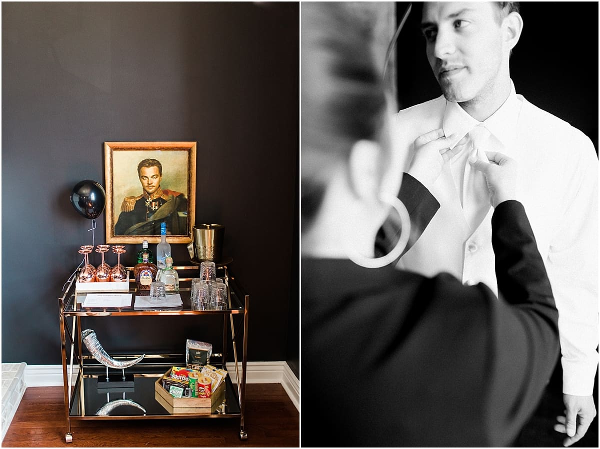 Arielle Peters Photography | Groom adjusting his tie while getting ready on wedding day at Loft 310 in Kalamazoo, Michigan.