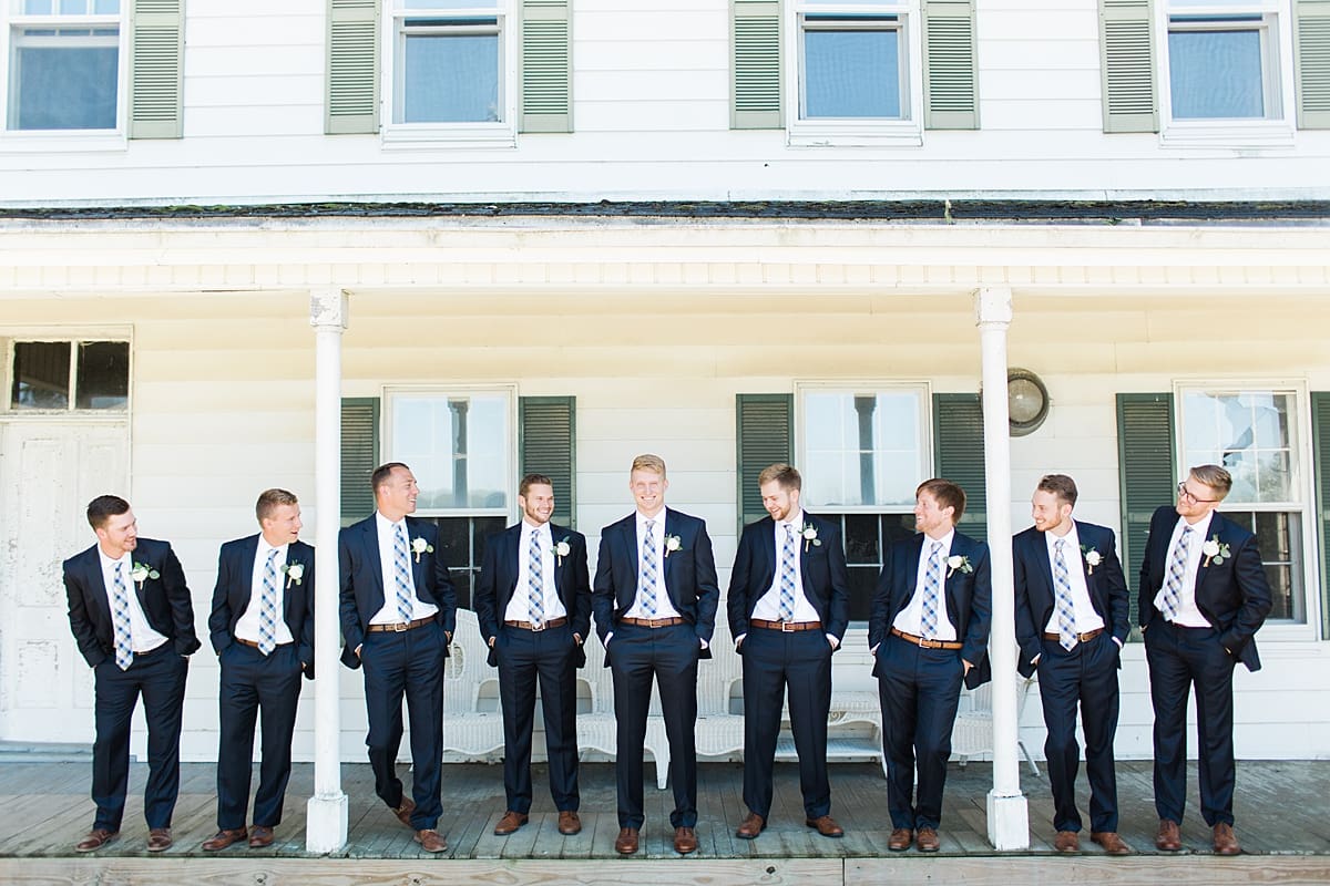 Arielle Peters Photography | Groom and groomsmen on historic front porch on wedding day at St. Joe Farm in Granger, Indiana.