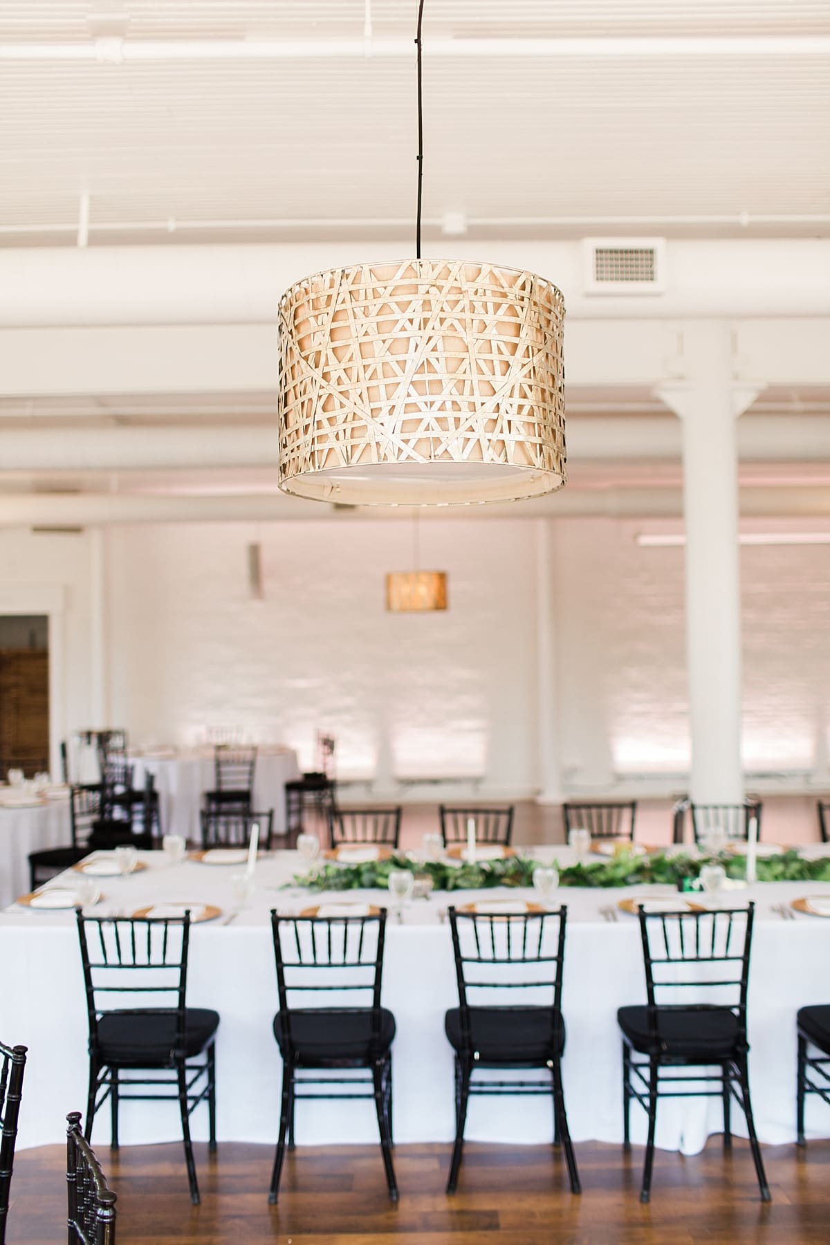 Arielle Peters Photography | Wedding reception table settings and floral arrangements on wedding day at Loft 310 in Kalamazoo, Michigan.