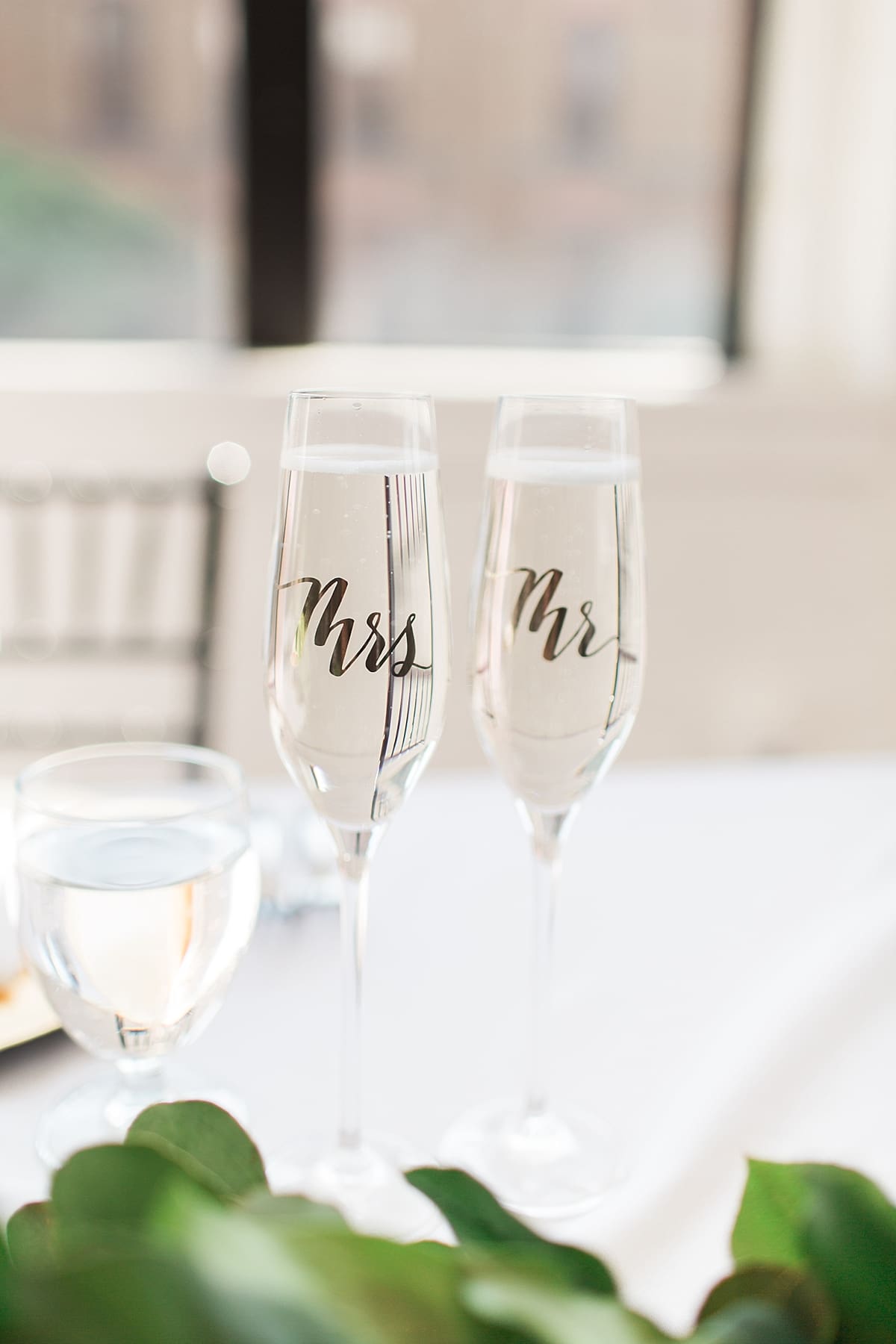 Arielle Peters Photography | Mr. and Mrs. champagne glasses at wedding reception on wedding day at Loft 310 in Kalamazoo, Michigan.