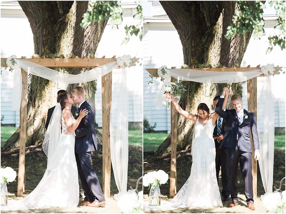 Arielle Peters Photography | Bride and groom kissing at the alter on historic farm on wedding day at St. Joe Farm in Granger, Indiana.