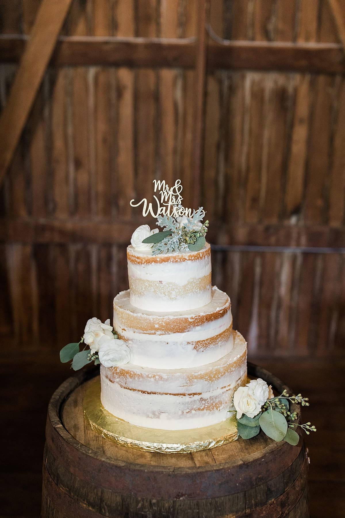 Arielle Peters Photography | Wedding cake inside historic barn on wedding day at St. Joe Farm in Granger, Indiana.