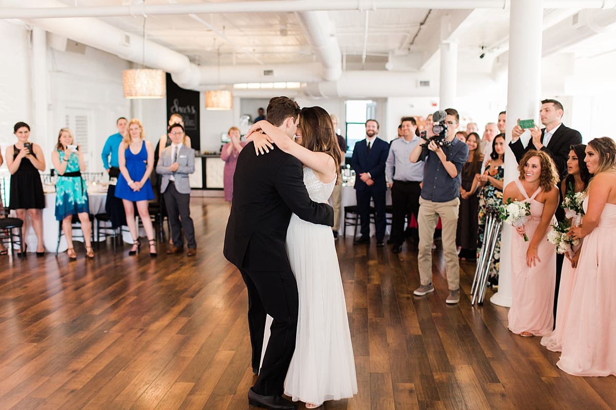 Arielle Peters Photography | Bride and groom sharing first dance at wedding reception on wedding day at Loft 310 in Kalamazoo, Michigan.