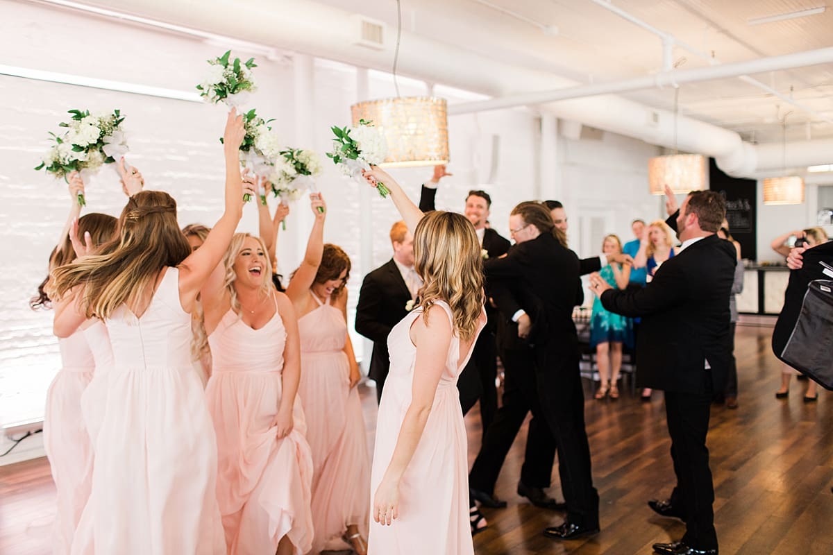 Arielle Peters Photography | Wedding guests dancing at wedding reception on wedding day at Loft 310 in Kalamazoo, Michigan.