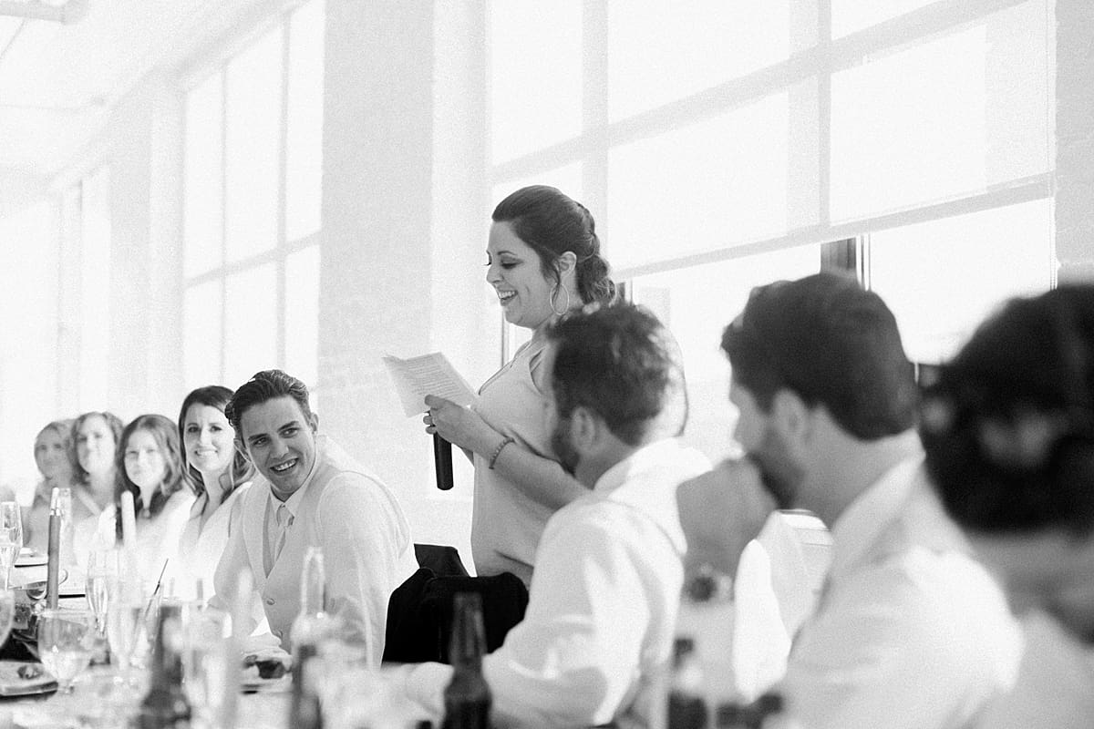 Arielle Peters Photography | Best man giving a speech at wedding reception on wedding day at Loft 310 in Kalamazoo, Michigan.