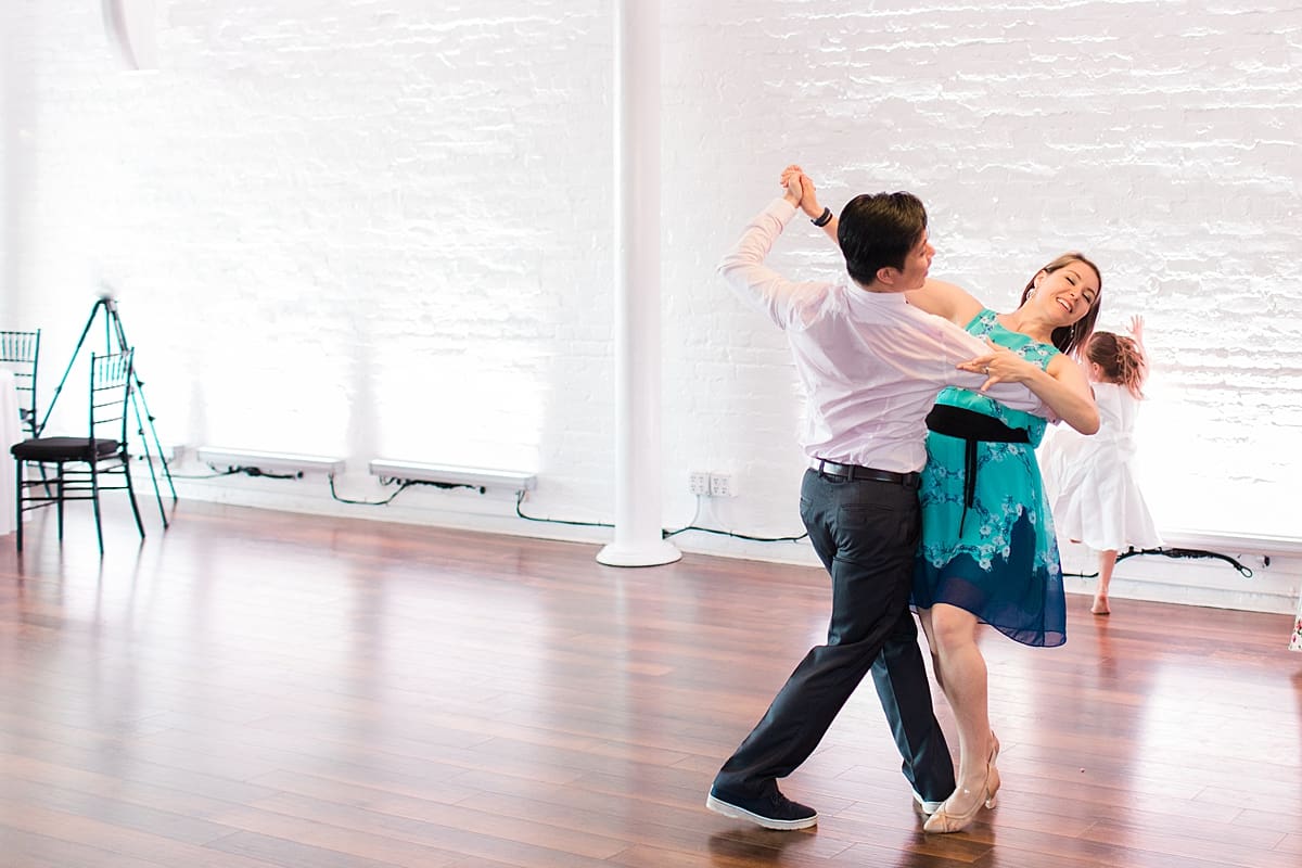 Arielle Peters Photography | Wedding guests tangoing at wedding reception on wedding day at Loft 310 in Kalamazoo, Michigan.