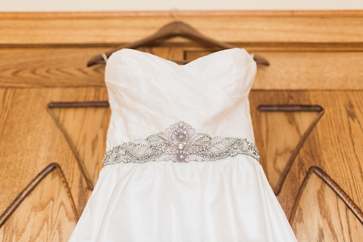Arielle Peters Photography | Wedding gown hanging in doorway on wedding day in Fort Wayne, Indiana. 