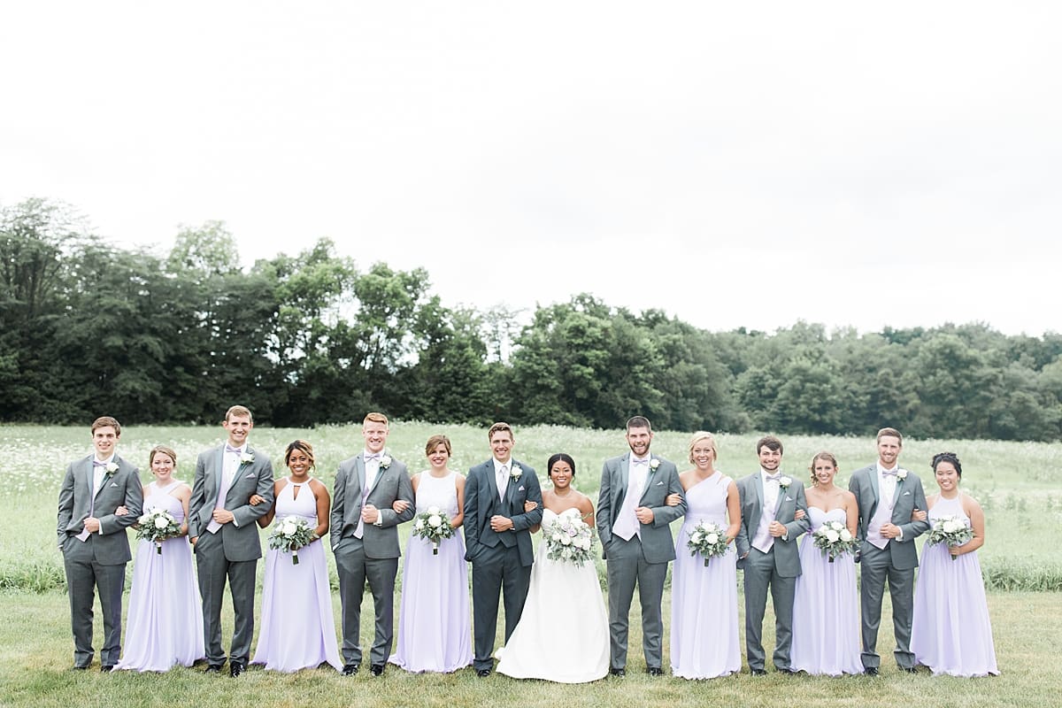 Arielle Peters Photography | Wedding party lined up outside on wedding day in Fort Wayne, Indiana. 