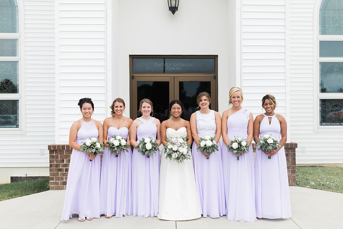 Arielle Peters Photography | Bride and bridesmaids outside church on wedding day in Fort Wayne, Indiana. 