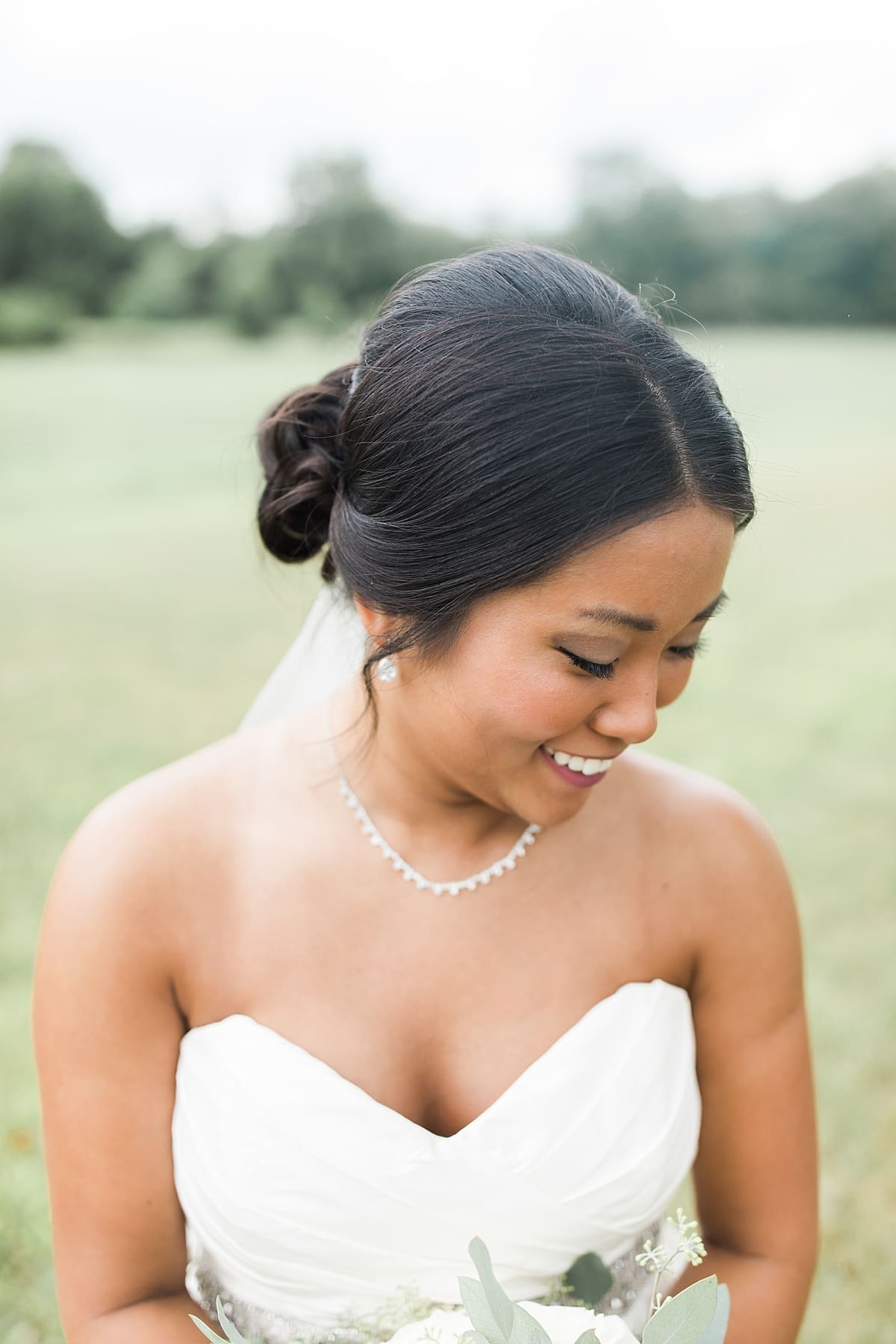 Arielle Peters Photography | Bride smiling outside in field on wedding day in Fort Wayne, Indiana. 