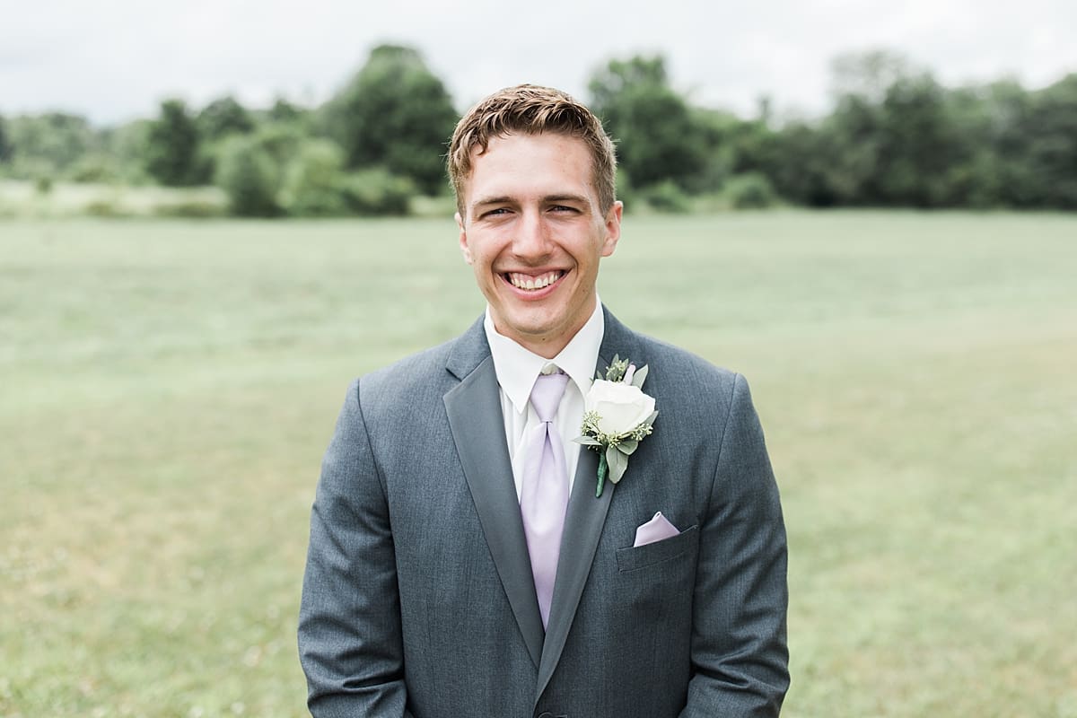 Arielle Peters Photography | Groom smiling in field on wedding day in Fort Wayne, Indiana. 