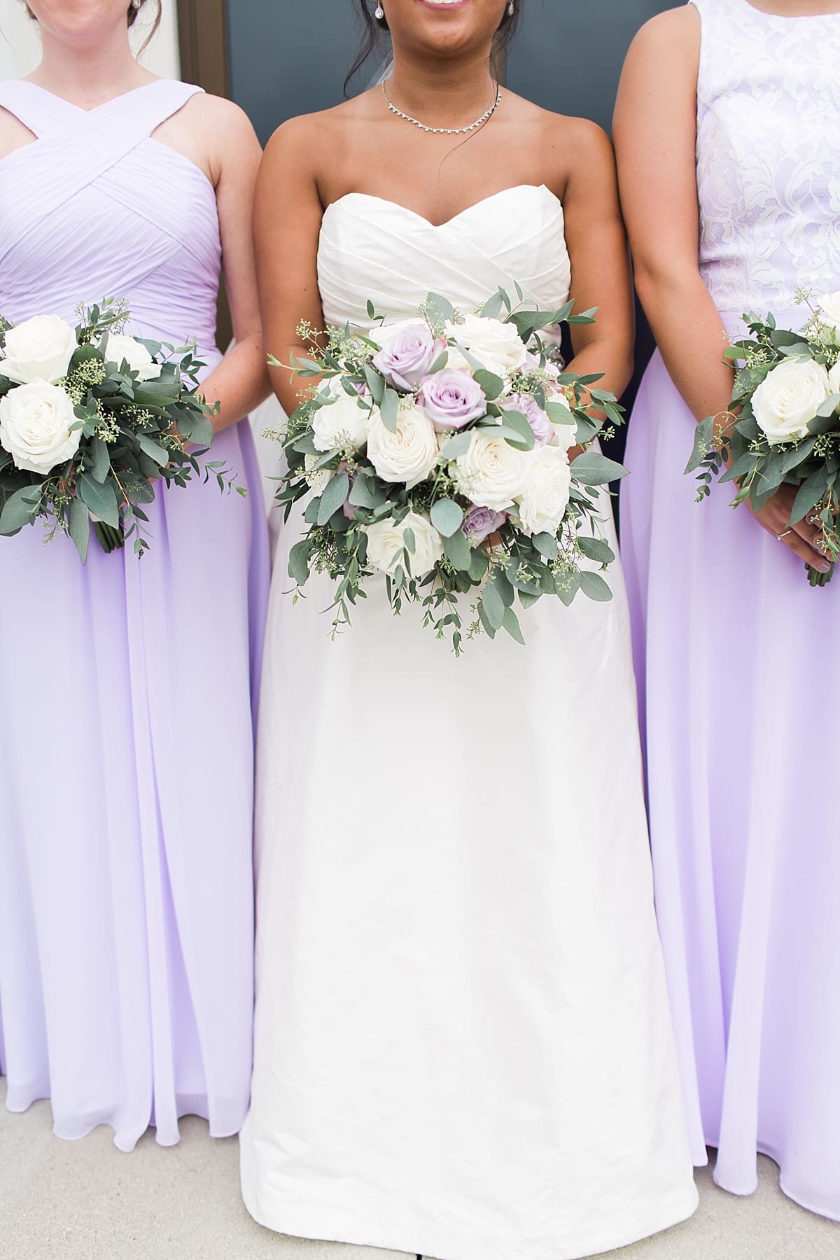 Arielle Peters Photography | Bride and bridesmaids holding bouquets on wedding day in Fort Wayne, Indiana. 