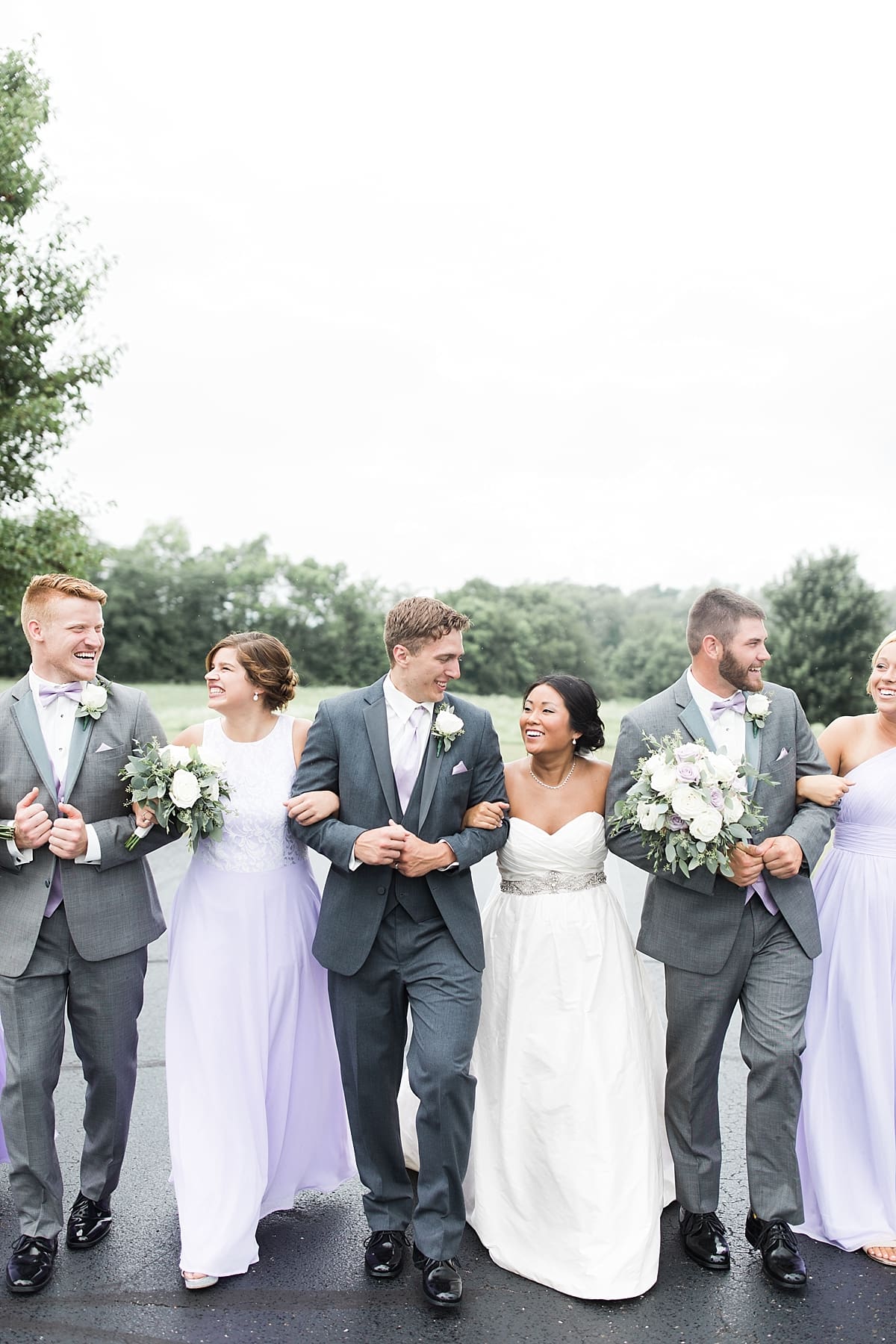 Arielle Peters Photography | Bride and groom walking outside on wedding day in Fort Wayne, Indiana. 