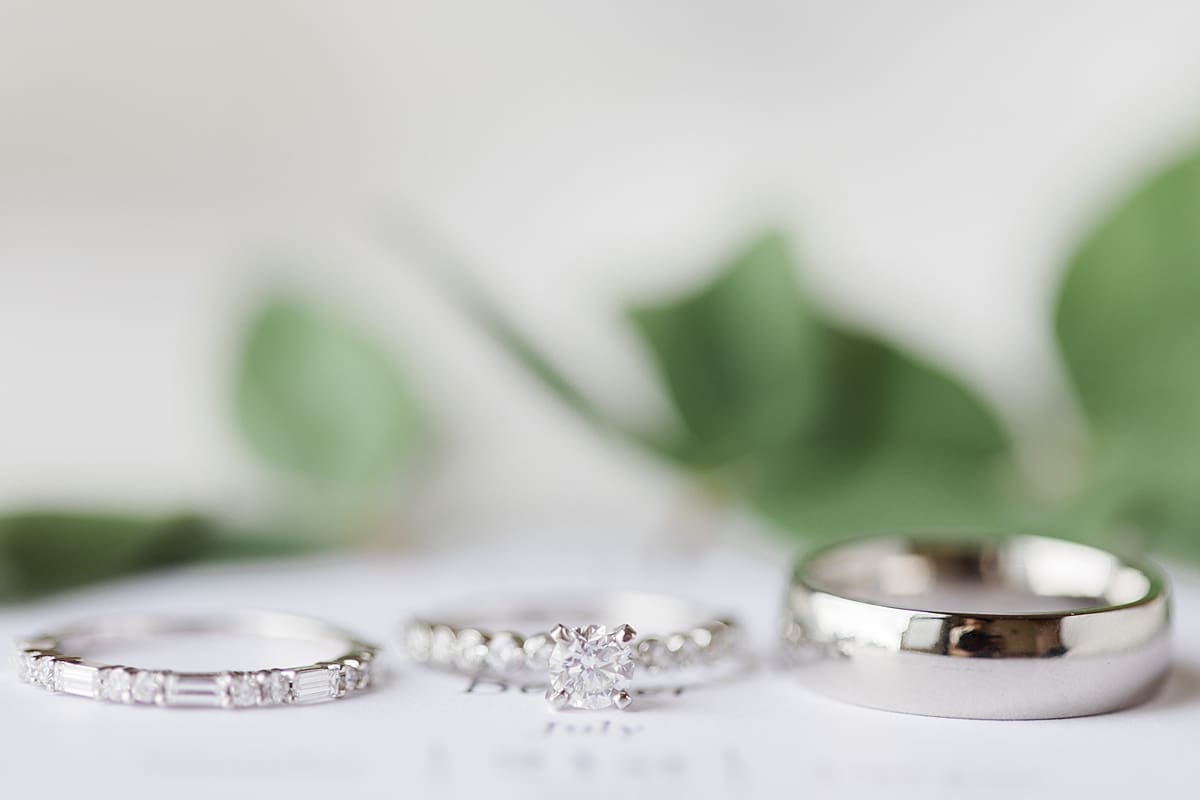 Arielle Peters Photography | Wedding rings lined up on invitation on wedding day in Fort Wayne, Indiana. 