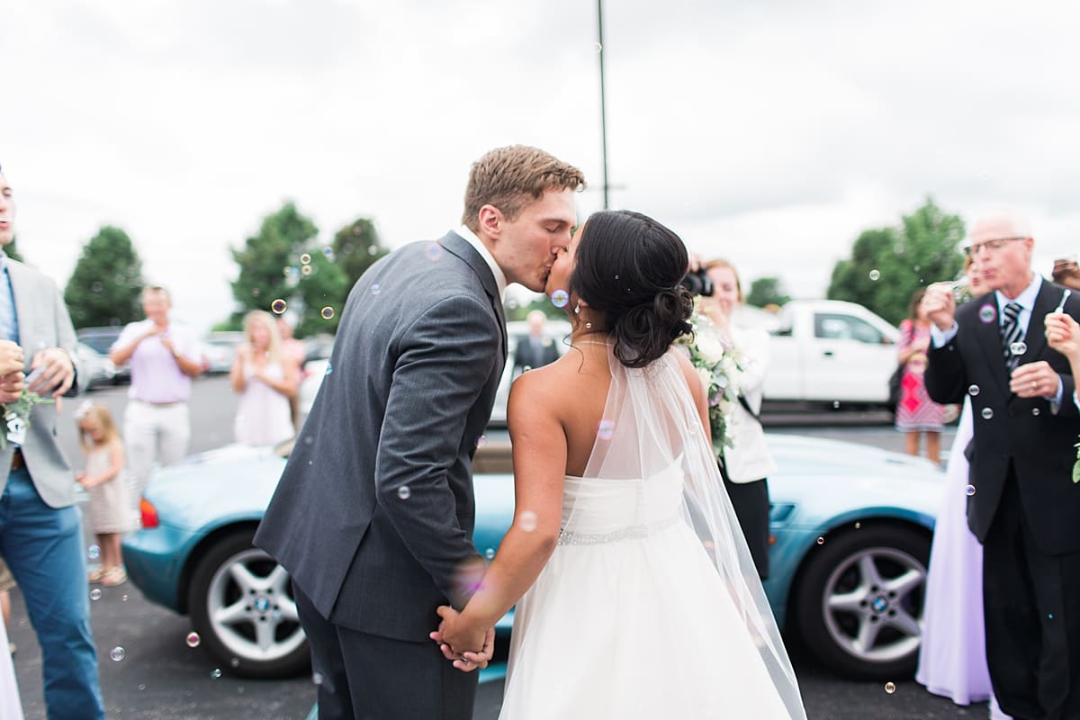 Arielle Peters Photography | Bride and groom kissing in bubbles on wedding day in Fort Wayne, Indiana. 