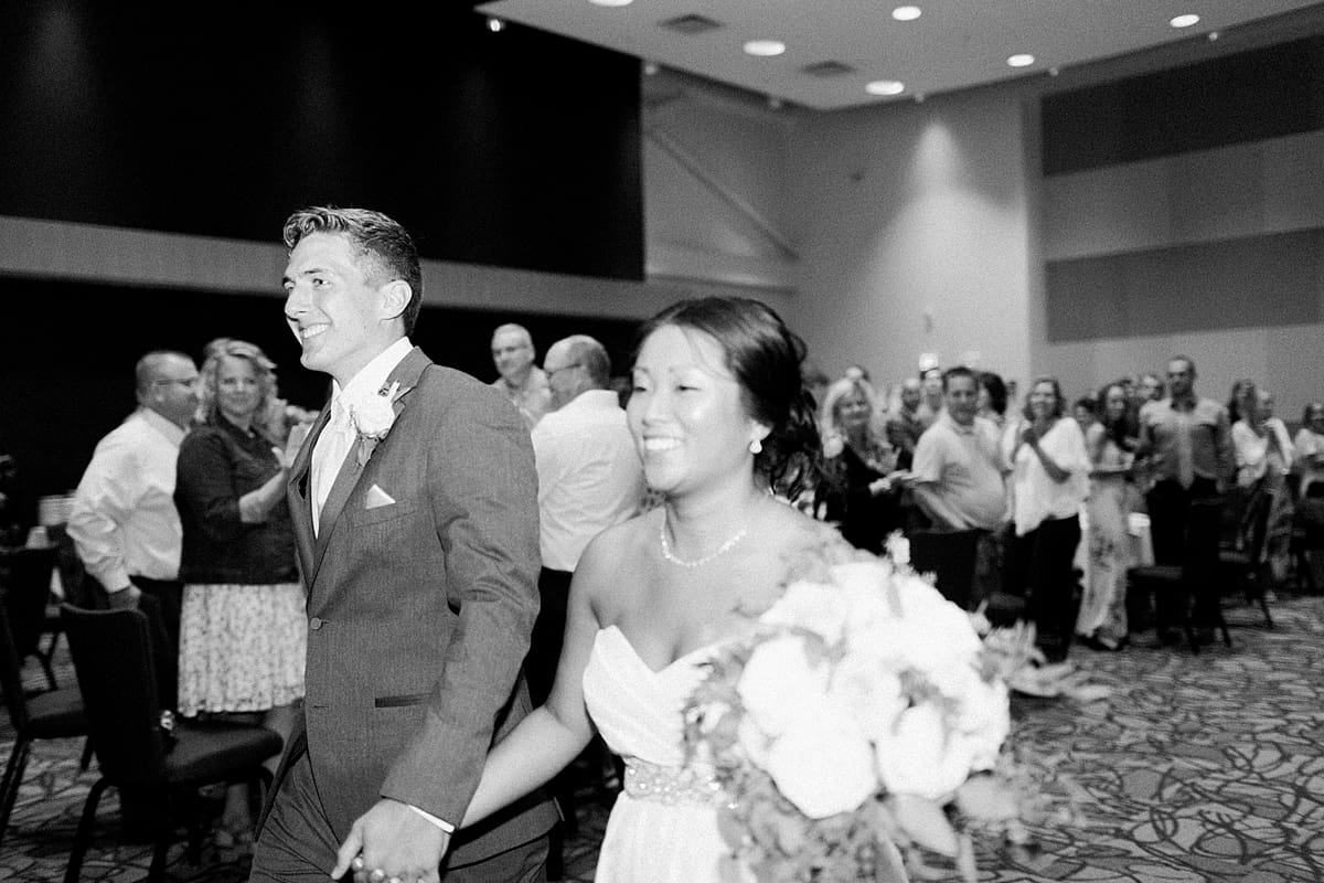 Arielle Peters Photography | Bride and groom entering wedding reception in Fort Wayne, Indiana. 