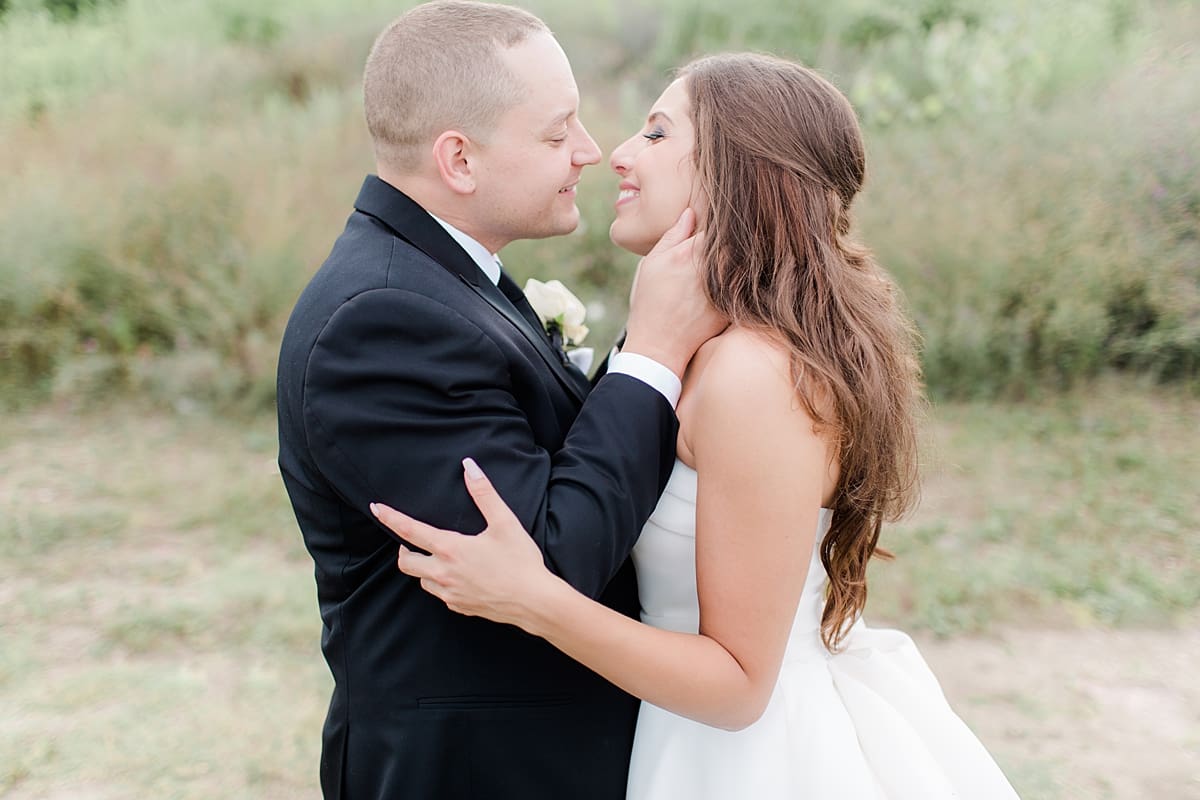 Arielle Peters Photography | Bride and groom kissing at wedding reception at The Inn at Harbor Springs in St. Joseph, Michigan.
