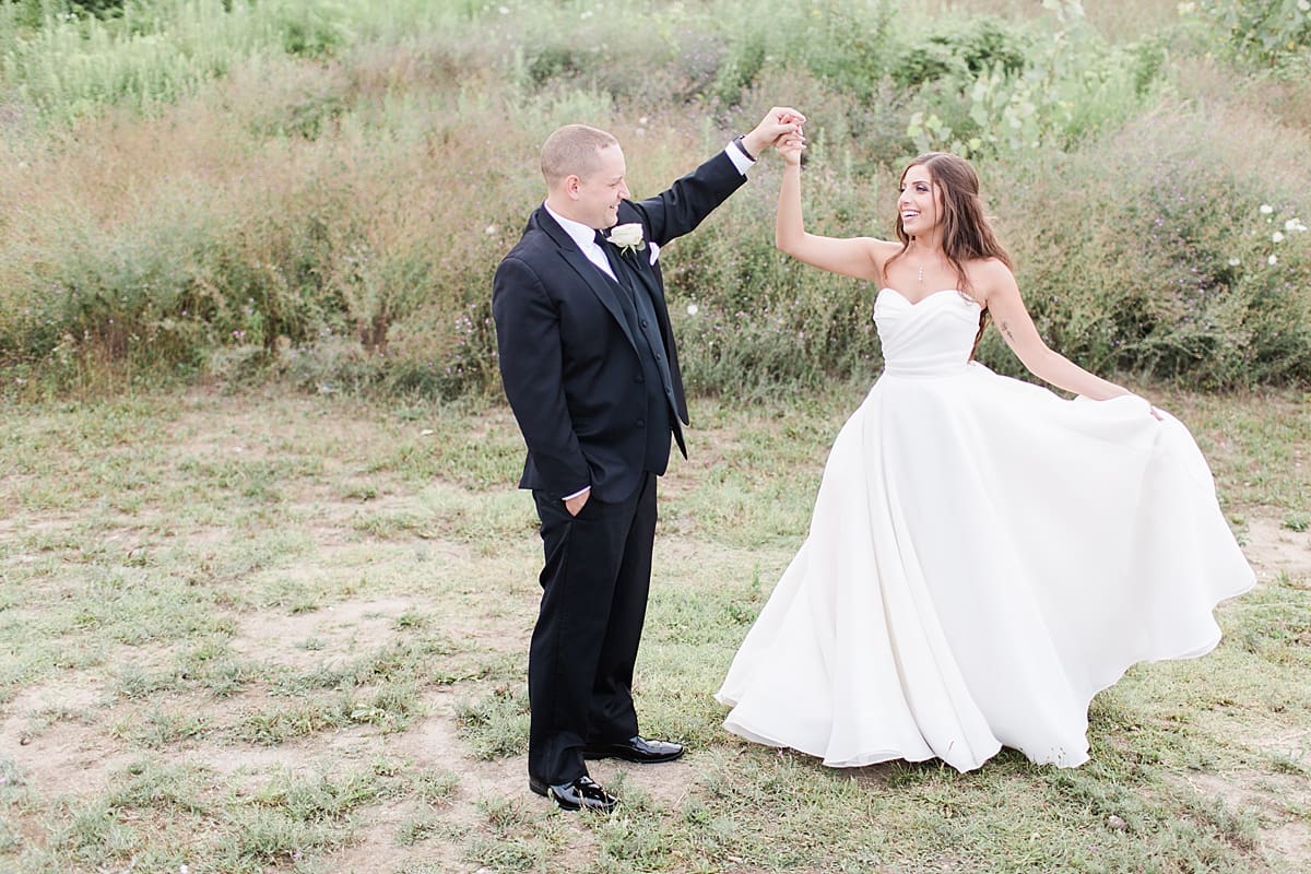 Arielle Peters Photography | Bride and groom dancing outside on wedding day at The Inn at Harbor Springs in St. Joseph, Michigan.