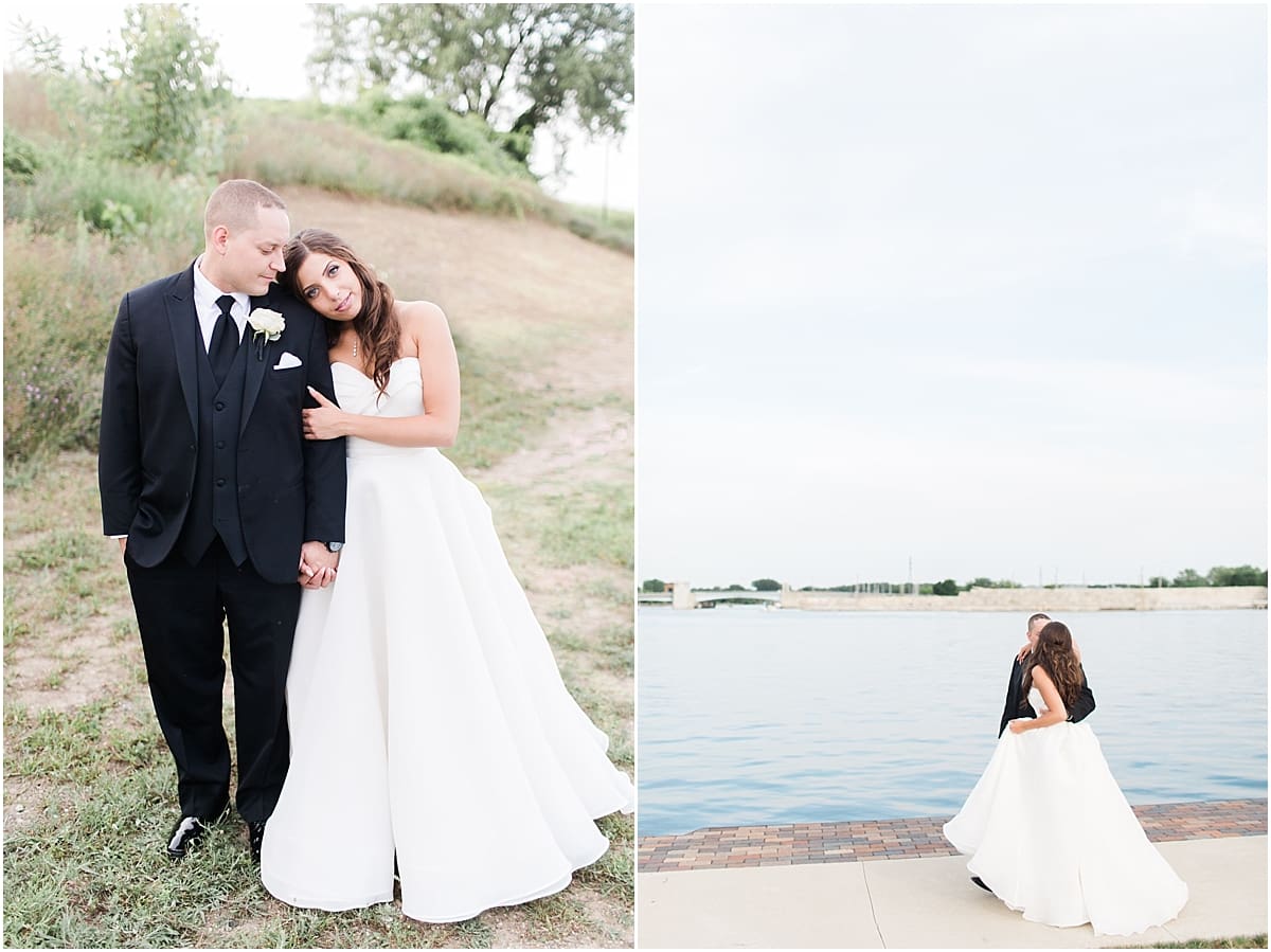 Arielle Peters Photography | Bride and groom kissing by the water wedding day at The Inn at Harbor Springs in St. Joseph, Michigan.