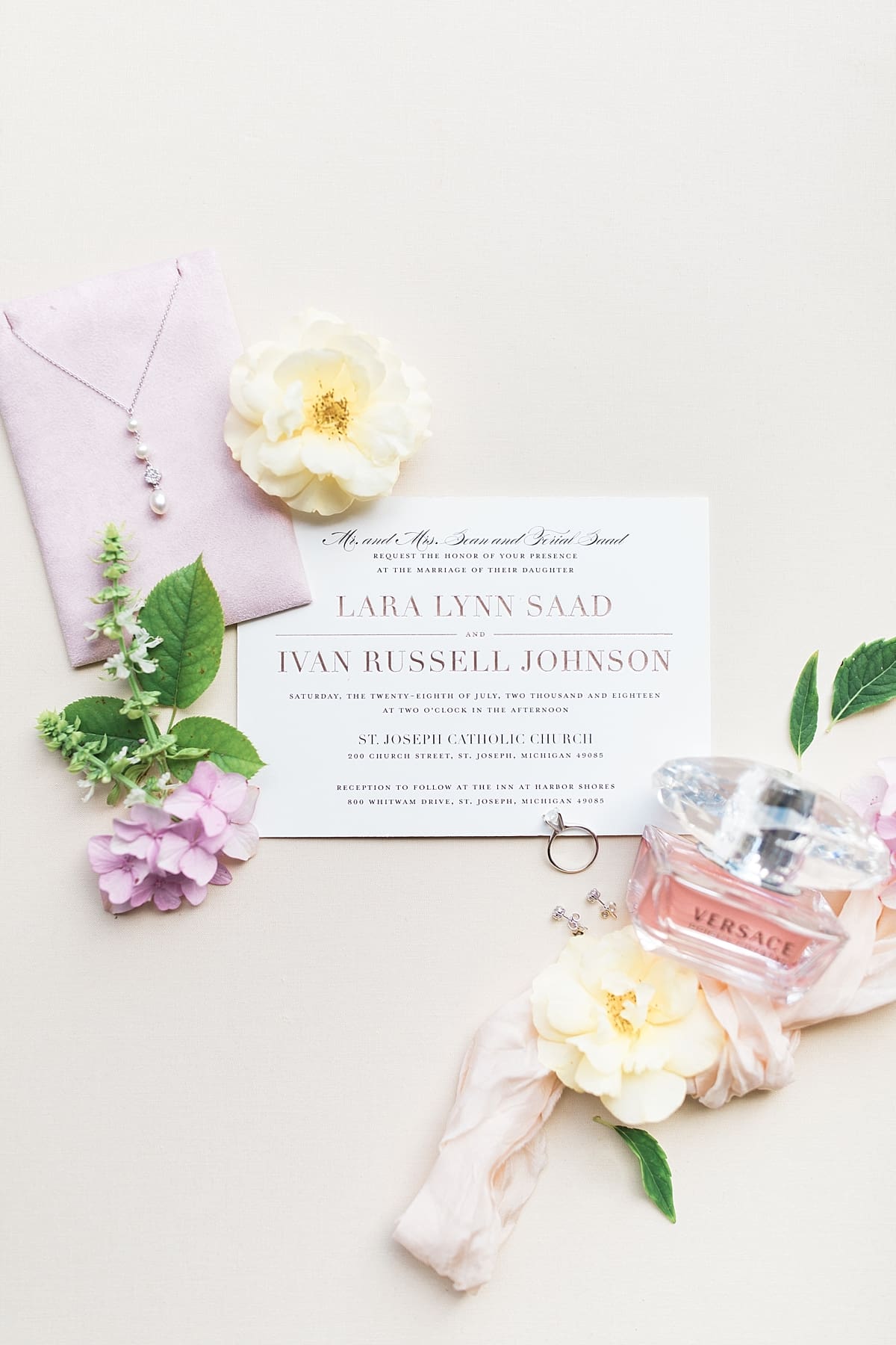 Arielle Peters Photography | Wedding invitation and flowers on wedding day at The Inn at Harbor Springs in St. Joseph, Michigan.