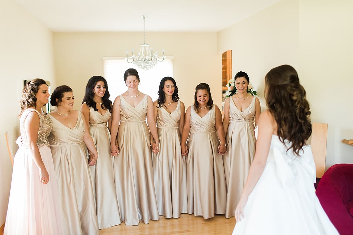 Arielle Peters Photography | Bridesmaids having first reveal of bride on wedding day at The Inn at Harbor Springs in St. Joseph, Michigan.