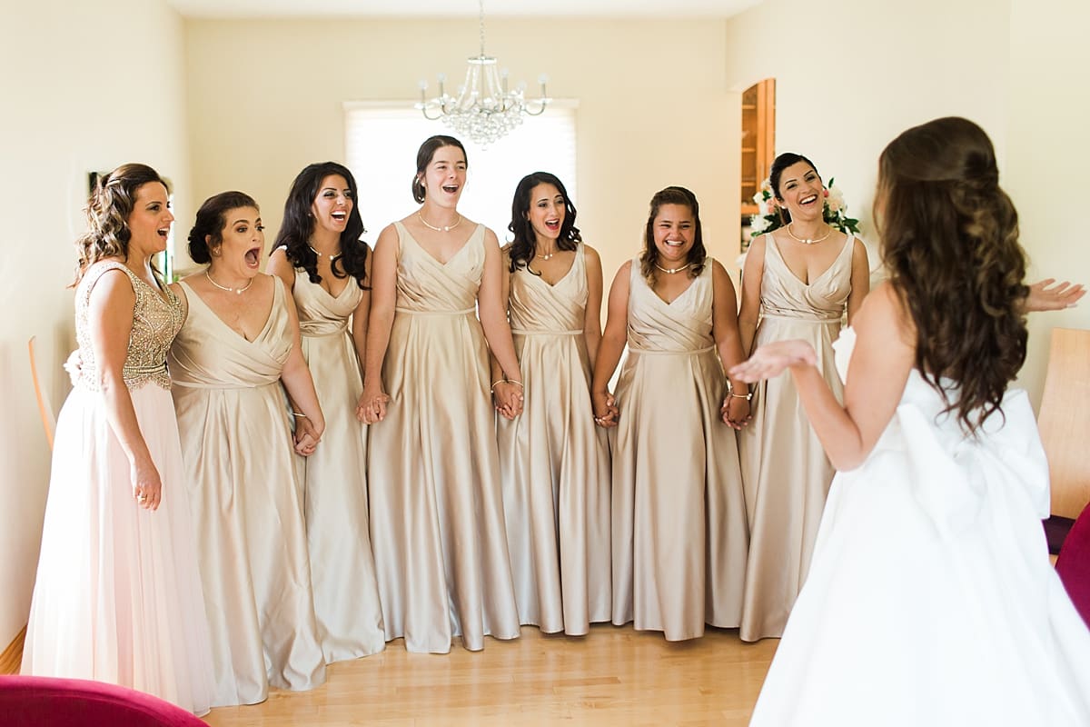 Arielle Peters Photography | Bridesmaids having first reveal of bride on wedding day at The Inn at Harbor Springs in St. Joseph, Michigan.