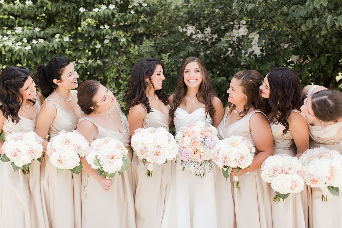 Arielle Peters Photography | Bride and bridesmaids outside on summer wedding day at The Inn at Harbor Springs in St. Joseph, Michigan.