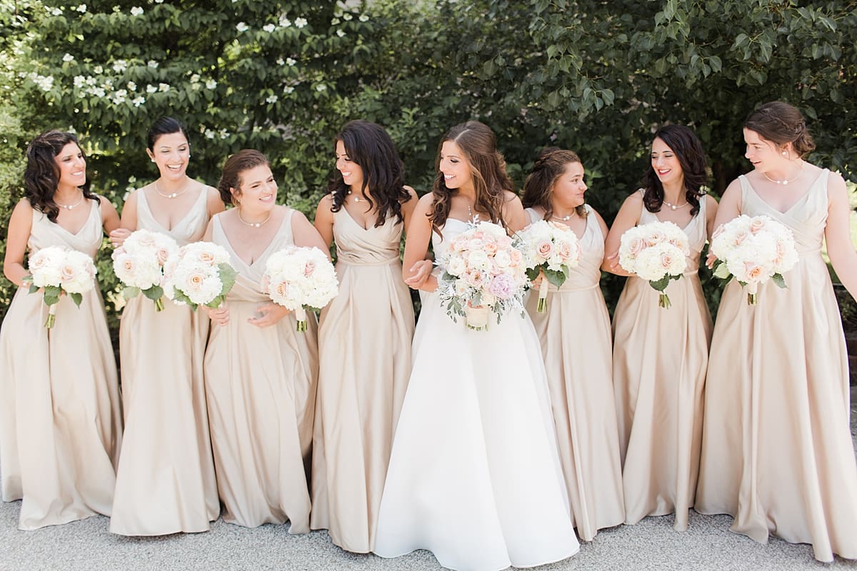 Arielle Peters Photography | Bride and bridesmaids outside on summer wedding day at The Inn at Harbor Springs in St. Joseph, Michigan.