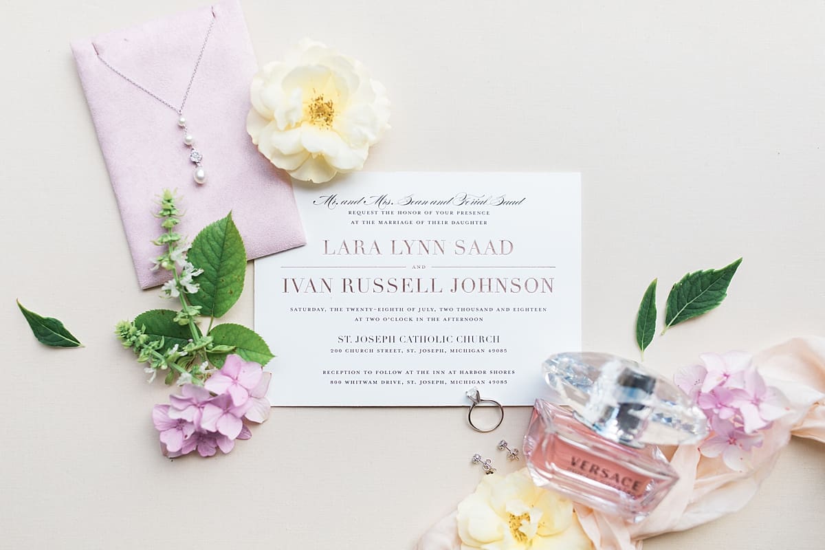 Arielle Peters Photography | Wedding invitation and jewelry at The Inn at Harbor Springs in St. Joseph, Michigan on wedding day.