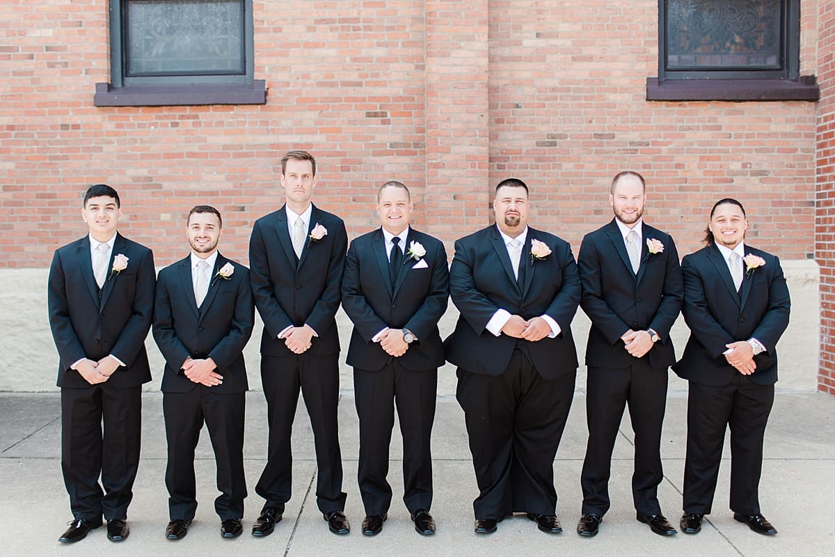 Arielle Peters Photography | Groom and groomsmen outside on summer wedding day at The Inn at Harbor Springs in St. Joseph, Michigan.