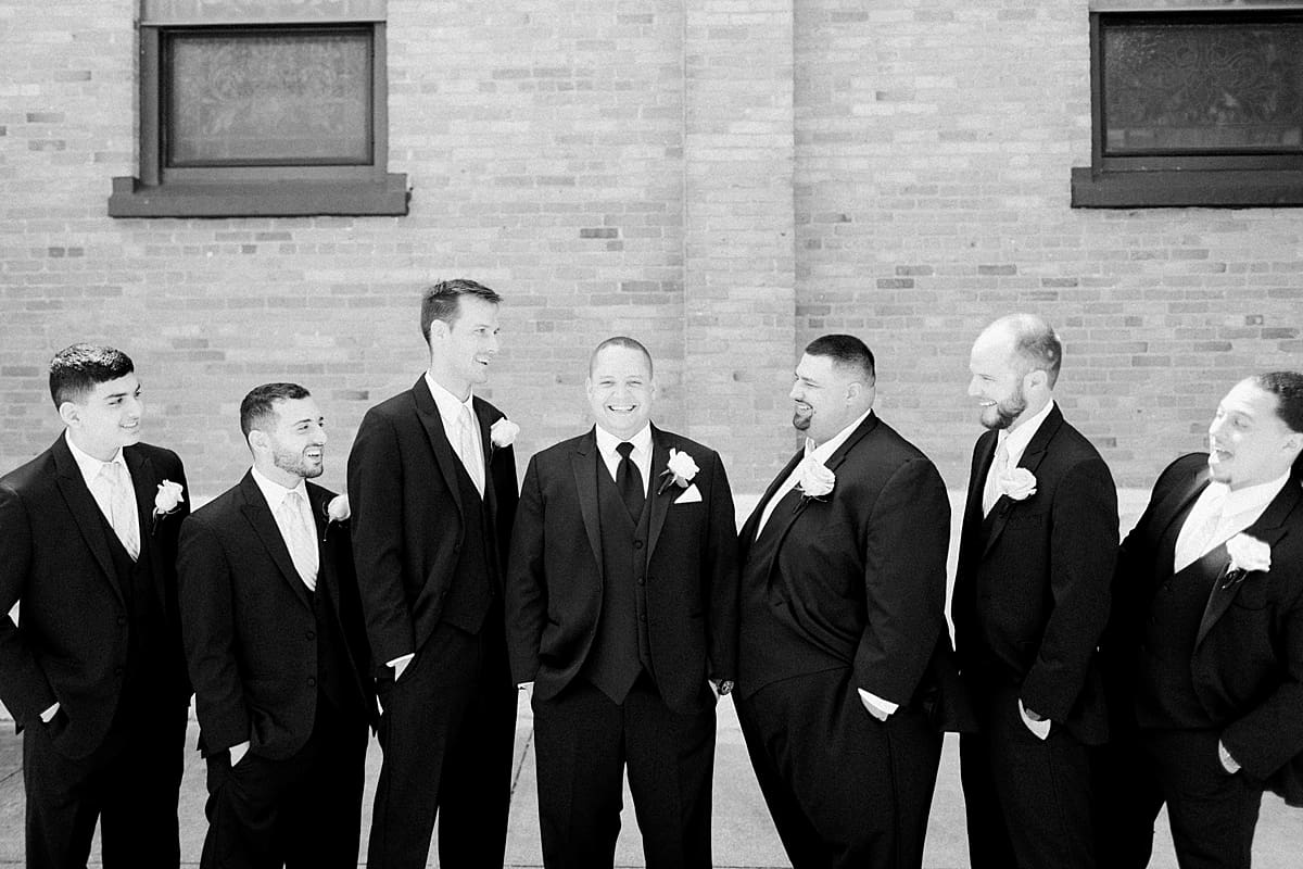Arielle Peters Photography | Groom and groomsmen outside on summer wedding day at The Inn at Harbor Springs in St. Joseph, Michigan.