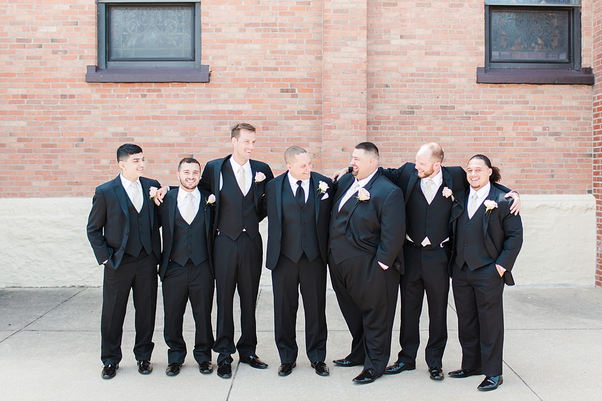 Arielle Peters Photography | Groom and groomsmen outside on summer wedding day at The Inn at Harbor Springs in St. Joseph, Michigan.