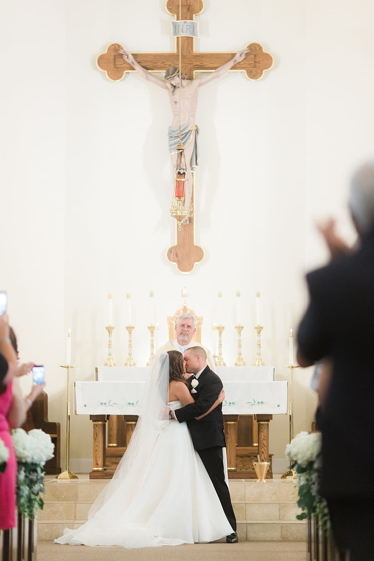 Arielle Peters Photography | Bride and groom kissing at the alter on wedding day at The Inn at Harbor Springs in St. Joseph, Michigan.