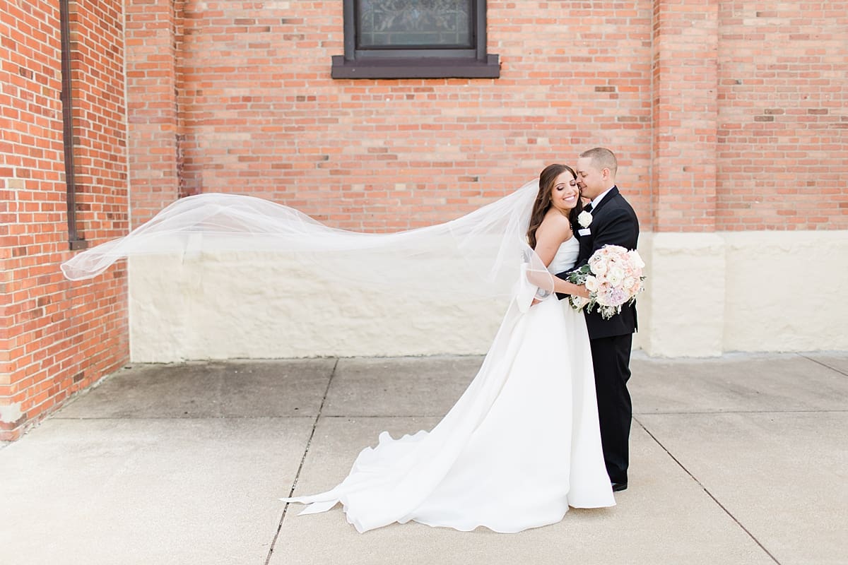 Arielle Peters Photography | Bride and groom outside church on summer wedding day at The Inn at Harbor Springs in St. Joseph, Michigan.