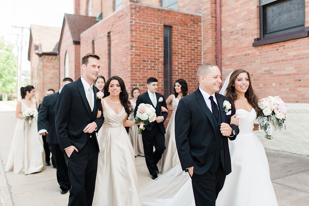 Arielle Peters Photography | Wedding party walking outside of church on summer wedding day at The Inn at Harbor Springs in St. Joseph, Michigan.