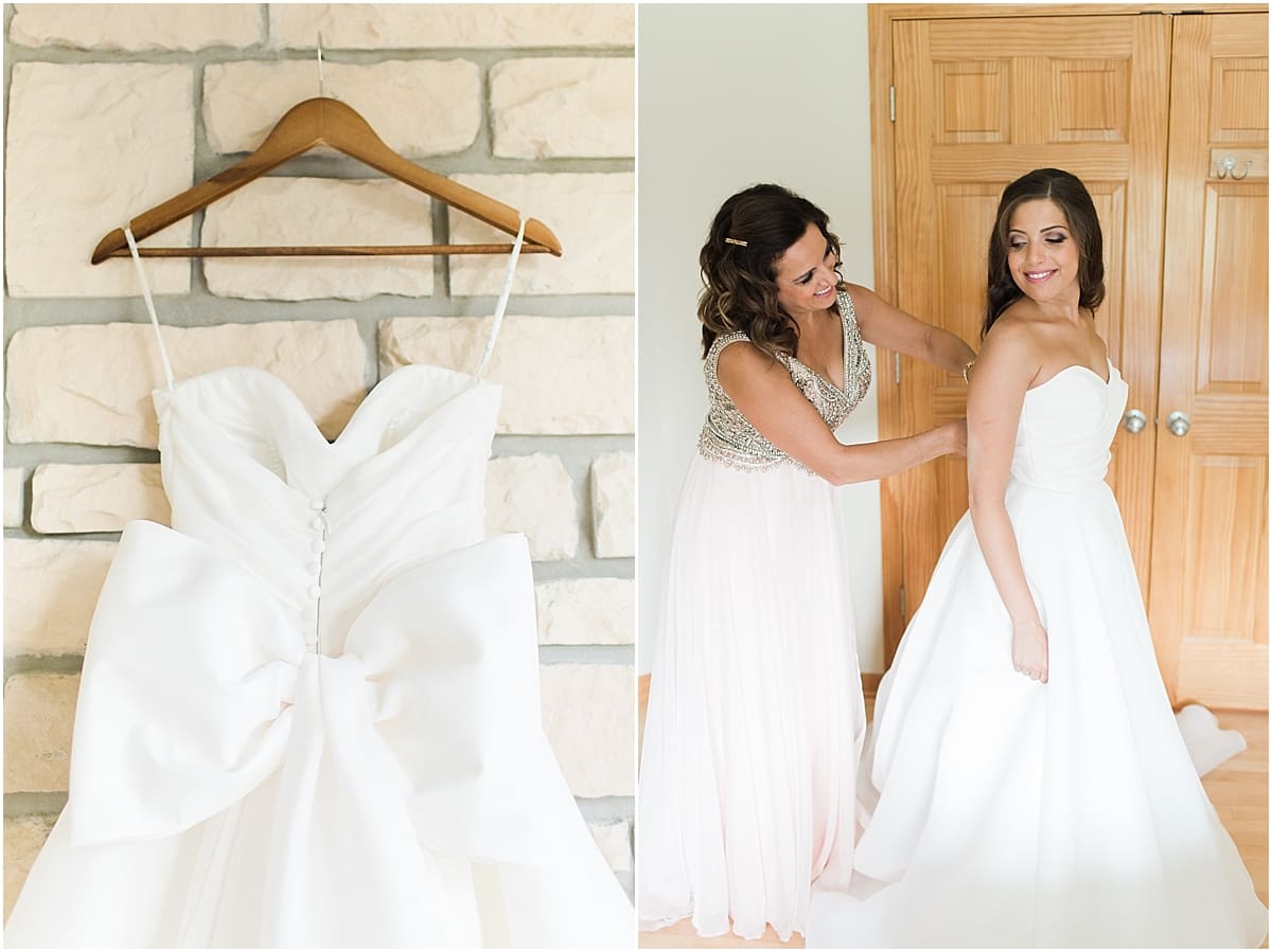 Arielle Peters Photography | Mother of the bride helping the bride get ready on wedding day at The Inn at Harbor Springs in St. Joseph, Michigan.