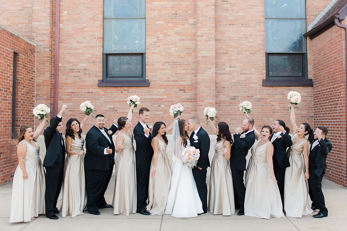 Arielle Peters Photography | Wedding party cheering on summer wedding day at The Inn at Harbor Springs in St. Joseph, Michigan.