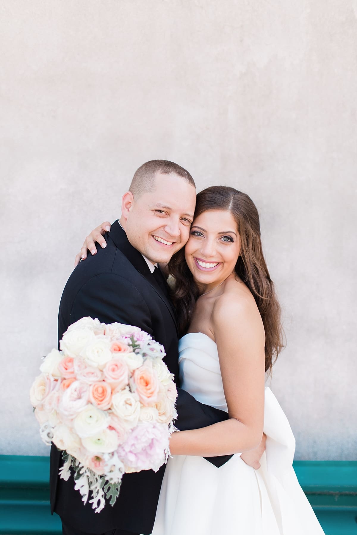 Arielle Peters Photography | Bride and groom smiling on summer wedding day at The Inn at Harbor Springs in St. Joseph, Michigan.