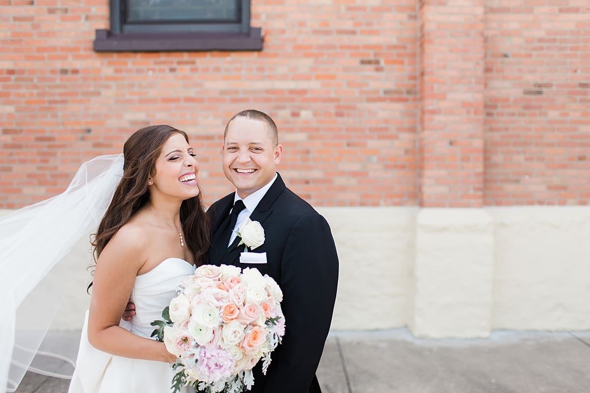 Arielle Peters Photography | Bride and groom laughing on summer wedding day at The Inn at Harbor Springs in St. Joseph, Michigan.