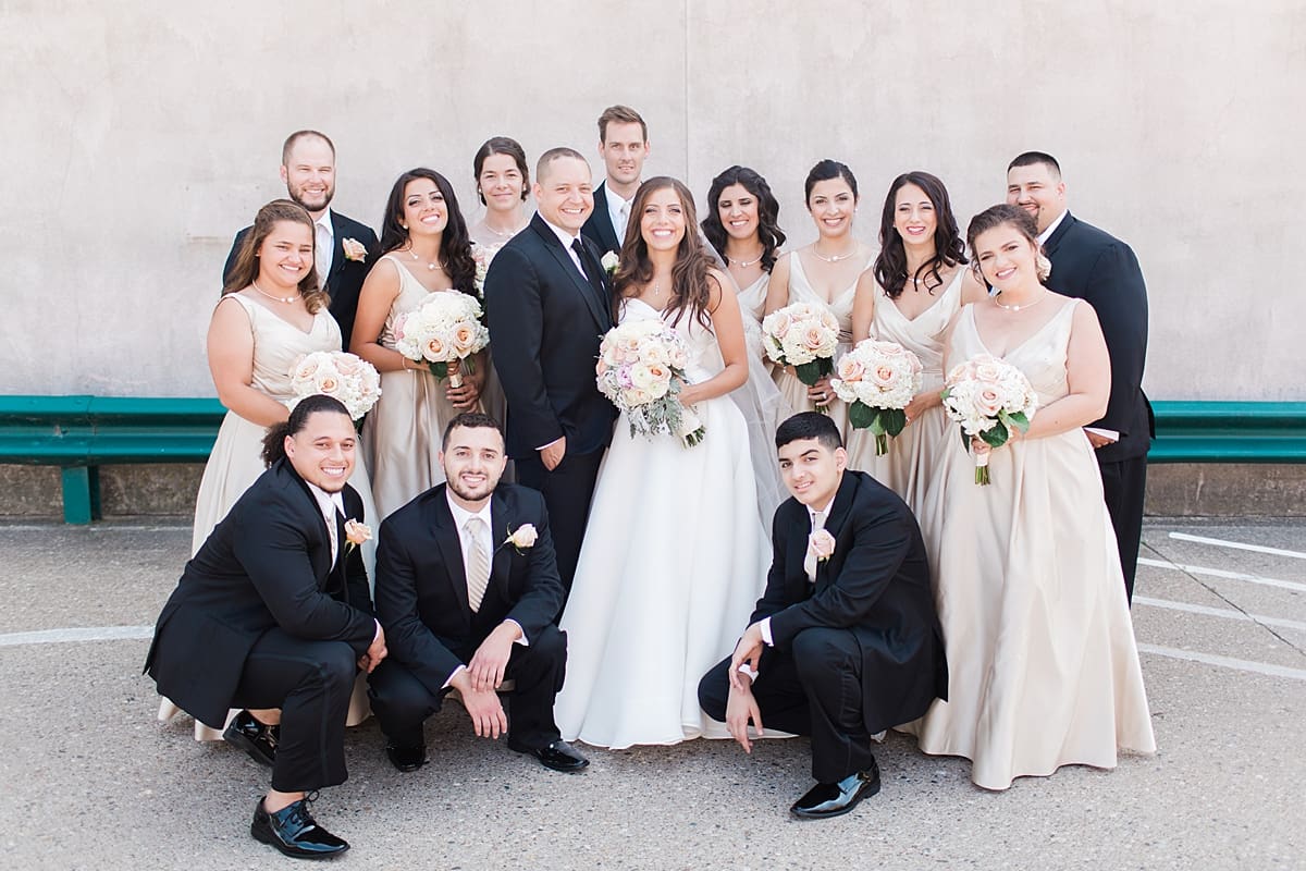 Arielle Peters Photography | Wedding party smiling on summer wedding day at The Inn at Harbor Springs in St. Joseph, Michigan.