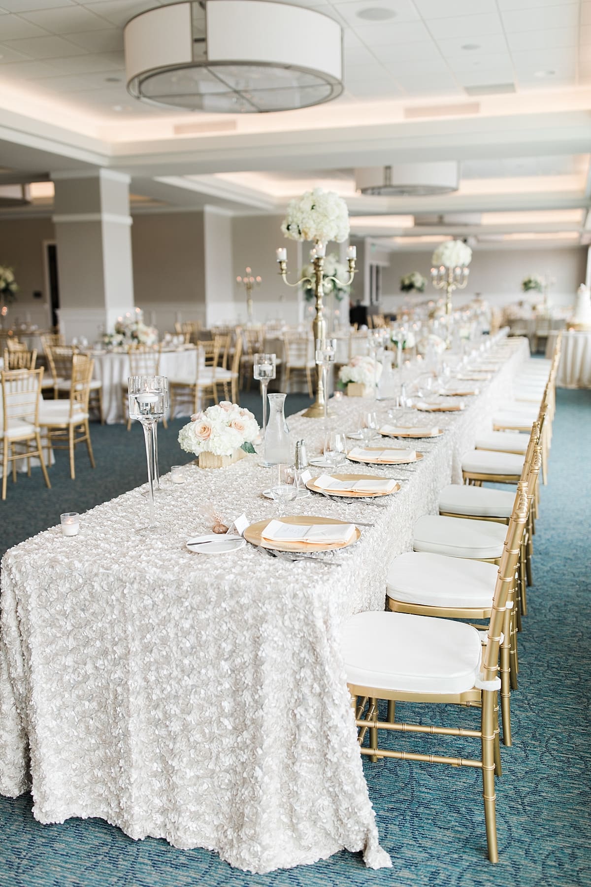 Arielle Peters Photography | Wedding reception table settings and floral arrangements at The Inn at Harbor Springs in St. Joseph, Michigan.
