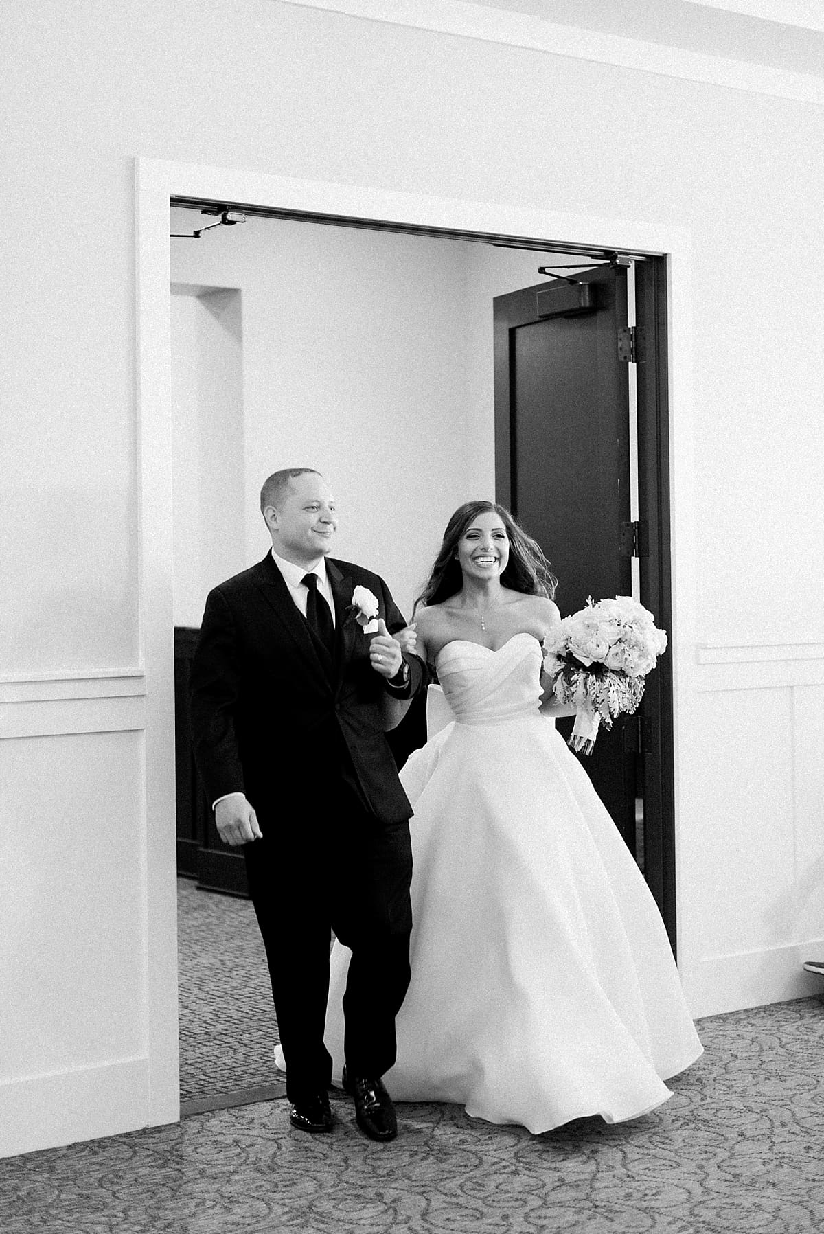 Arielle Peters Photography | Bride and groom entering wedding reception at The Inn at Harbor Springs in St. Joseph, Michigan.