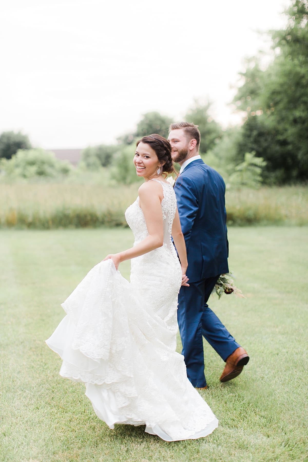Arielle Peters Photography | Bride and groom walking outside on wedding day at the Banquets at The Croatian Center in Merrillville, Indiana.