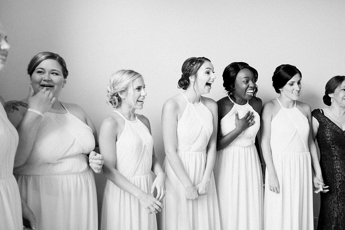 Arielle Peters Photography | Bride and bridesmaids having first reveal on wedding day at Newlife Community Church in Chicago, Illinois.