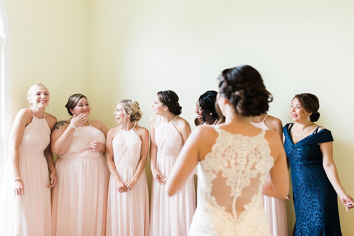 Arielle Peters Photography | Bride and bridesmaids having first reveal on wedding day at Newlife Community Church in Chicago, Illinois.